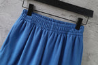 Balenciaga blue pants flat view showing elastic waistband and side seams