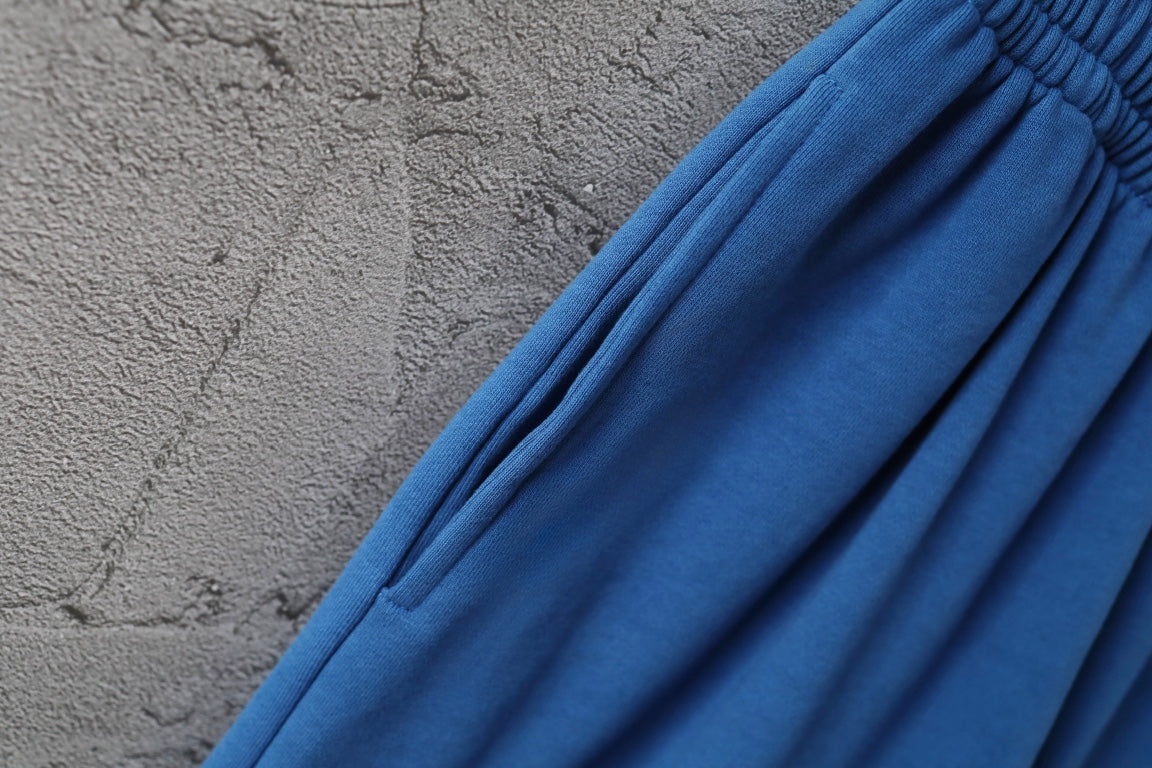 Balenciaga blue pants with gathered waistband and fabric drape detail