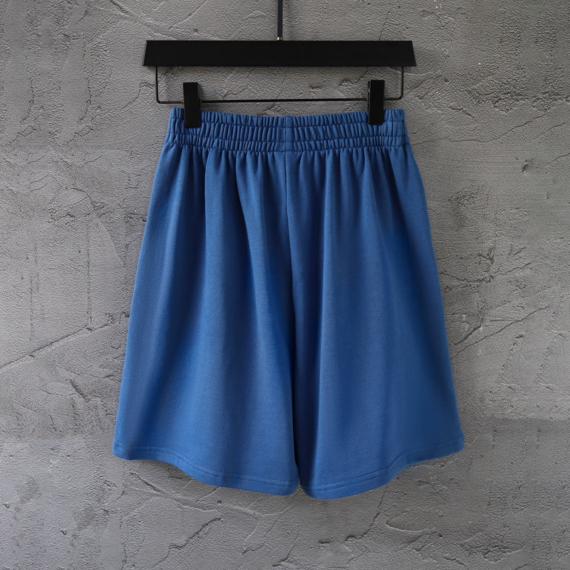 Balenciaga blue pants with elastic waist, pleated front, and wide leg shape