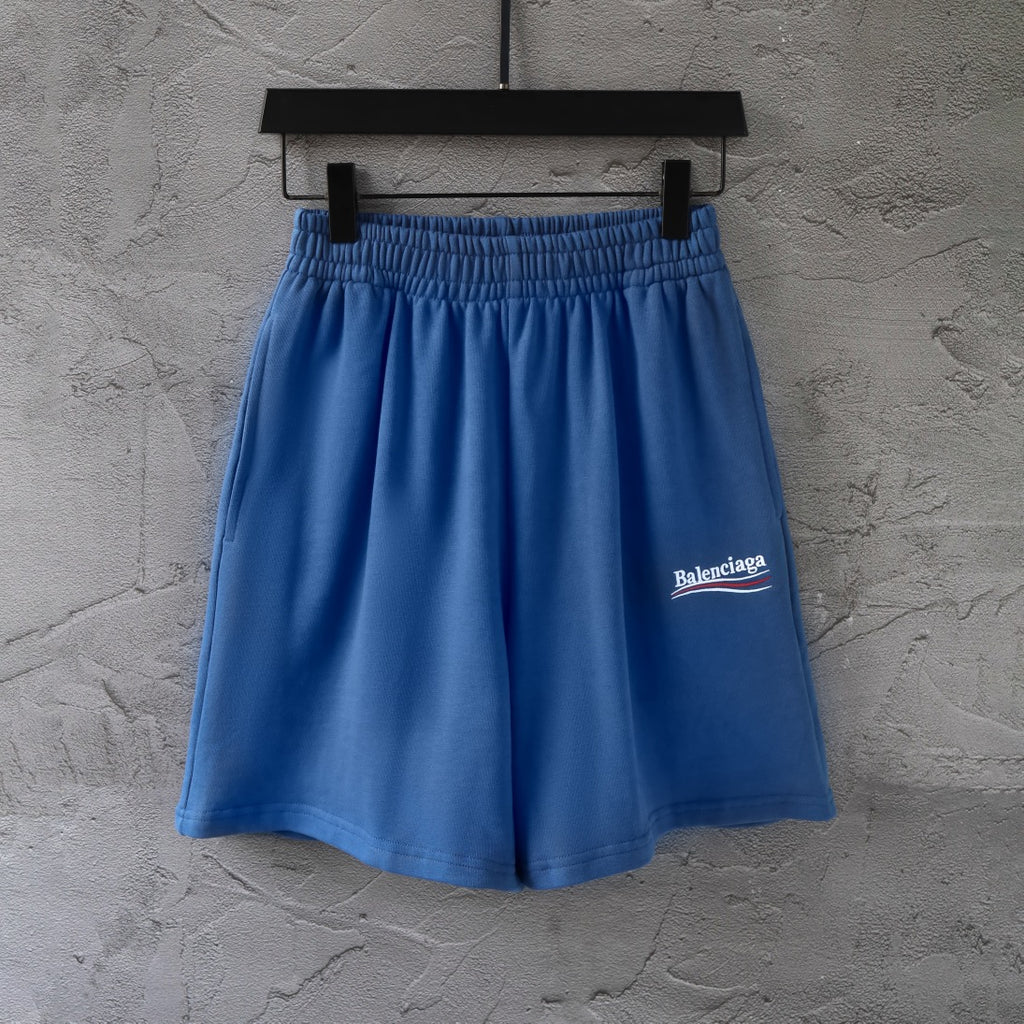 Balenciaga blue pants with elastic waistband and small logo patch on leg