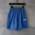 Balenciaga blue pants with elastic waistband and small logo patch on leg