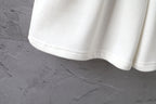 White shorts hem with elastic waist and smooth fabric drape