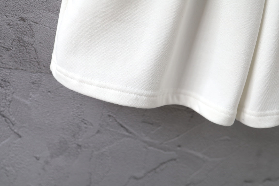 White shorts hem with elastic waist and smooth fabric drape