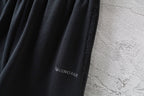 Balenciaga logo patch on black shorts leg