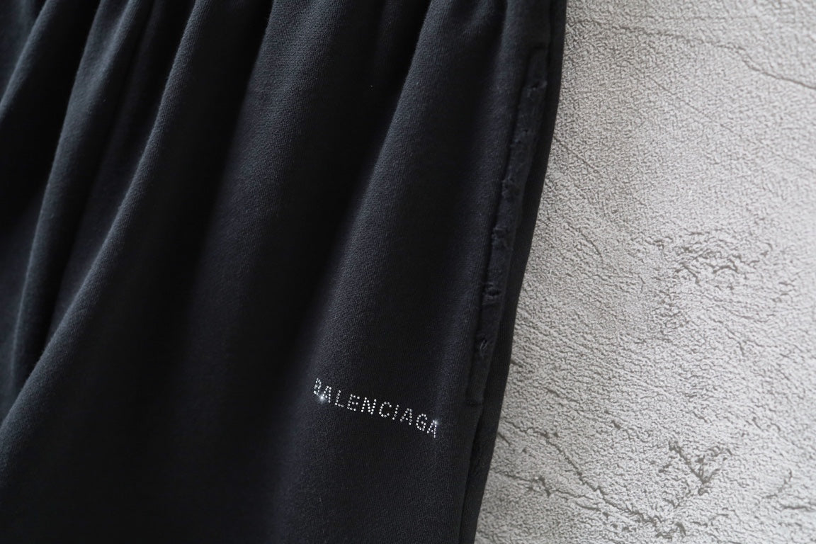 Balenciaga logo patch on black shorts leg