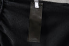 Black shorts fabric with interior care label tag attached