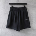 Black Balenciaga drawstring shorts with elastic waist and loose fit