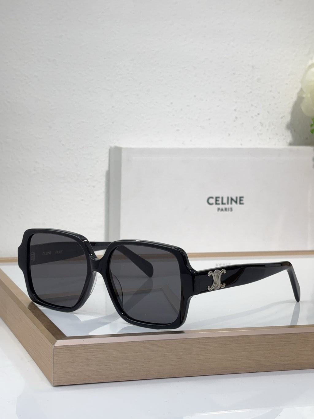 Celine black oversized sunglasses with gold logo detail and dark tinted lenses