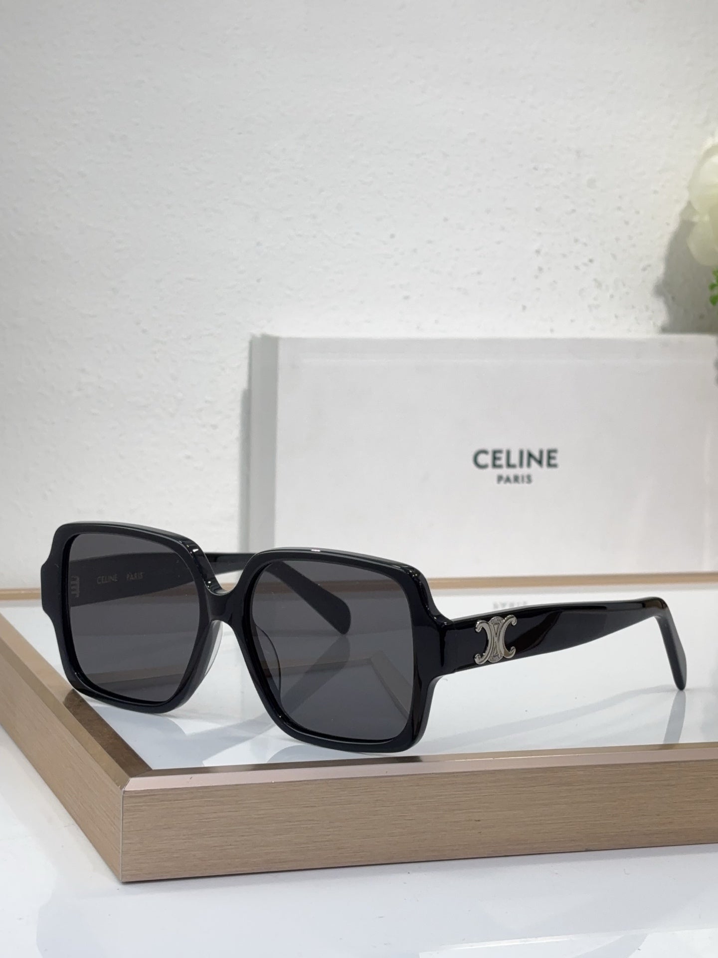 Celine black oversized sunglasses with gold logo detail and dark tinted lenses