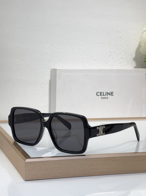 Celine black oversized sunglasses with gold logo detail and dark tinted lenses