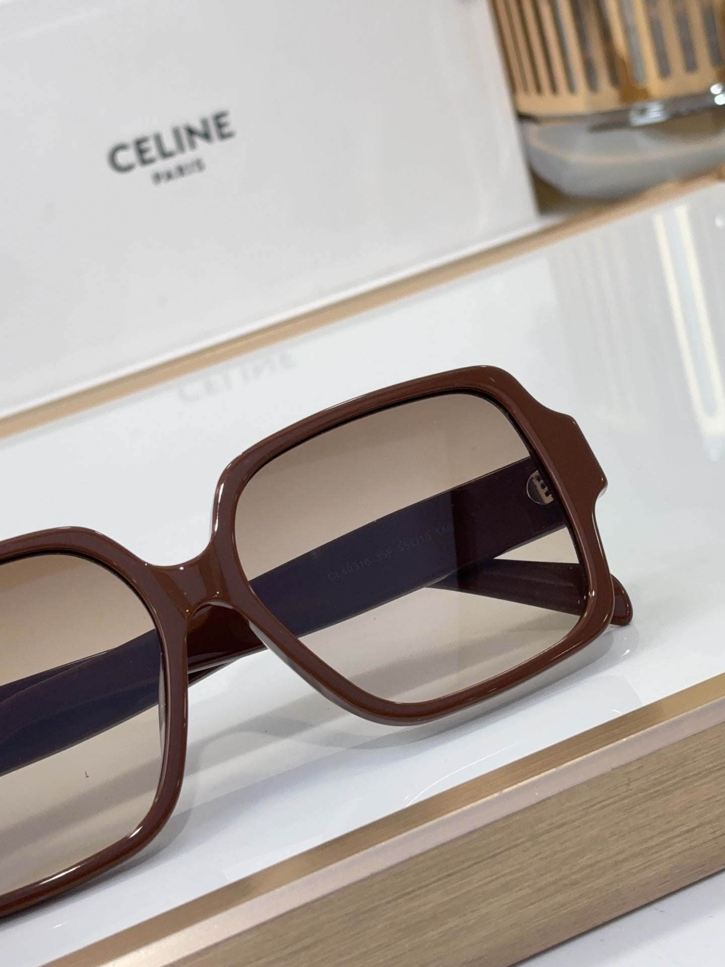 Celine brown square sunglasses with dark tinted lenses and logo on temple