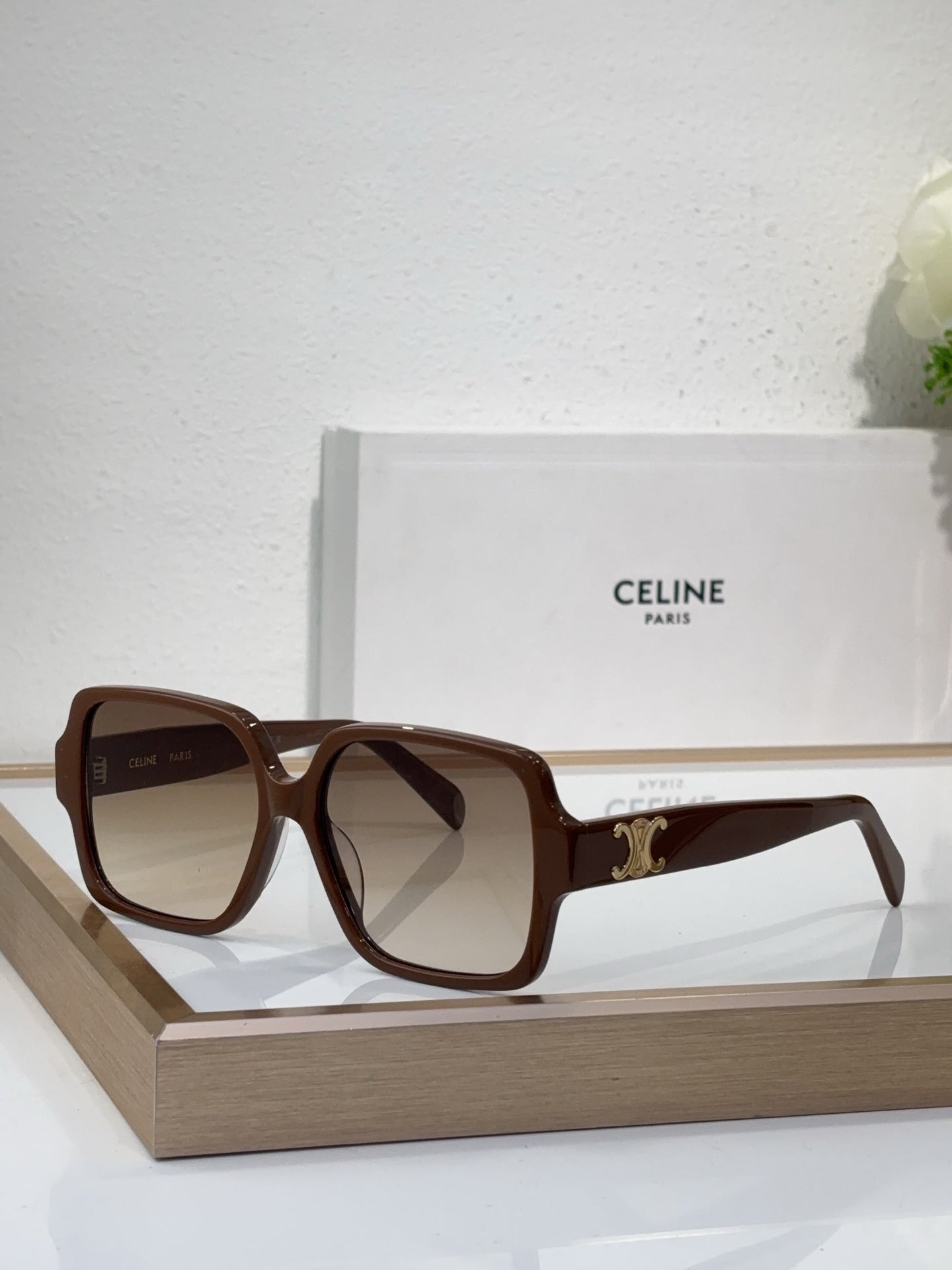 Celine brown oversized sunglasses with gold logo detail and dark tinted lenses