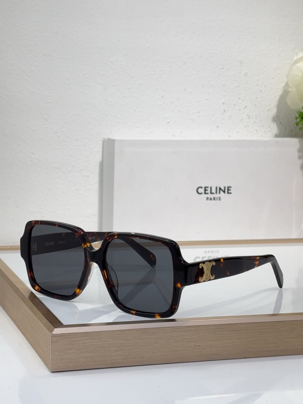 Celine tortoiseshell oversized sunglasses with gold logo detail and dark tinted lenses