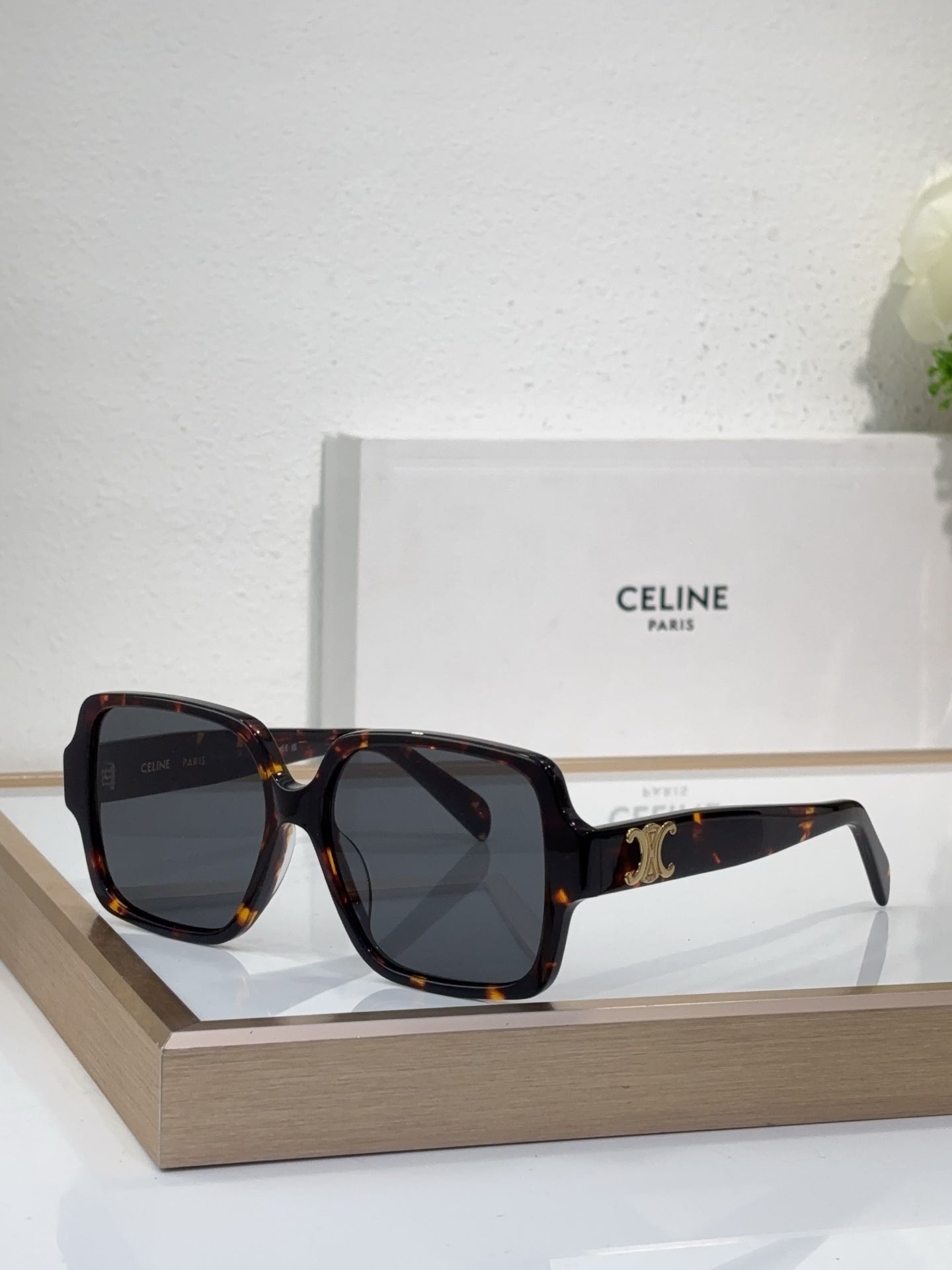 Celine tortoiseshell oversized sunglasses with gold logo detail and dark tinted lenses