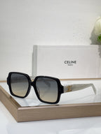 Celine black oversized sunglasses with gold logo detail and smoky tinted lenses