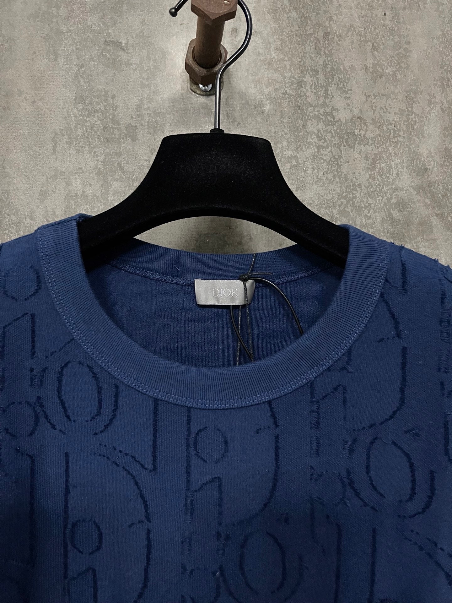 Dior dark blue crewneck T-shirt neckline with hang tag and embossed logo