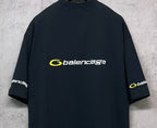 Dark crewneck T-shirt back view with yellow Balenciaga logo and side sleeve print