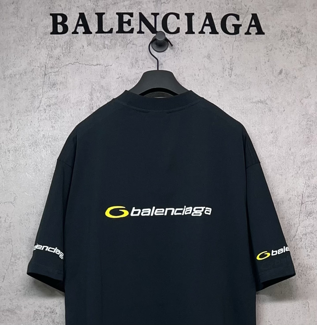 Dark Balenciaga T-shirt back view with yellow logo and sleeve logo patches
