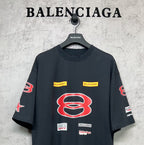 Dark navy short-sleeve T-shirt with large red B emblem and small logo labels.