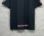 Dark navy short-sleeve T-shirt back hem with red BALENCIAGA-style text print.