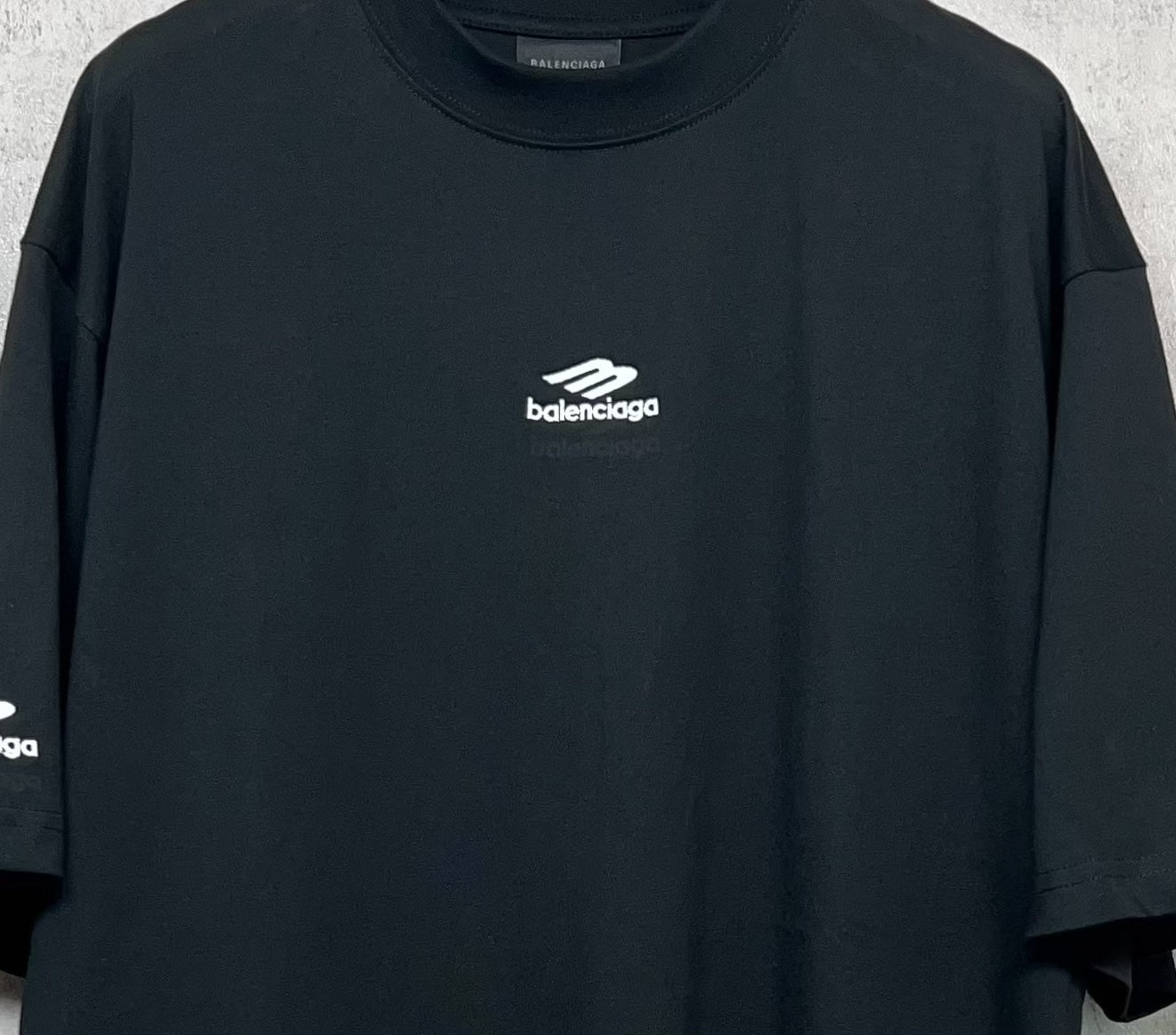 Balenciaga short-sleeve crewneck T-shirt close-up of chest logo and neckline