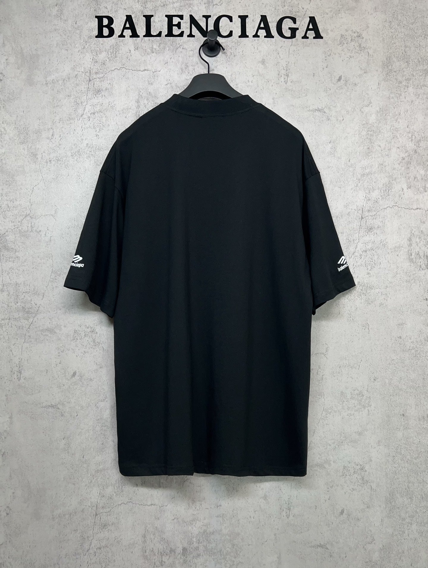 Balenciaga short-sleeve crewneck T-shirt, back view with logo accents on sleeves