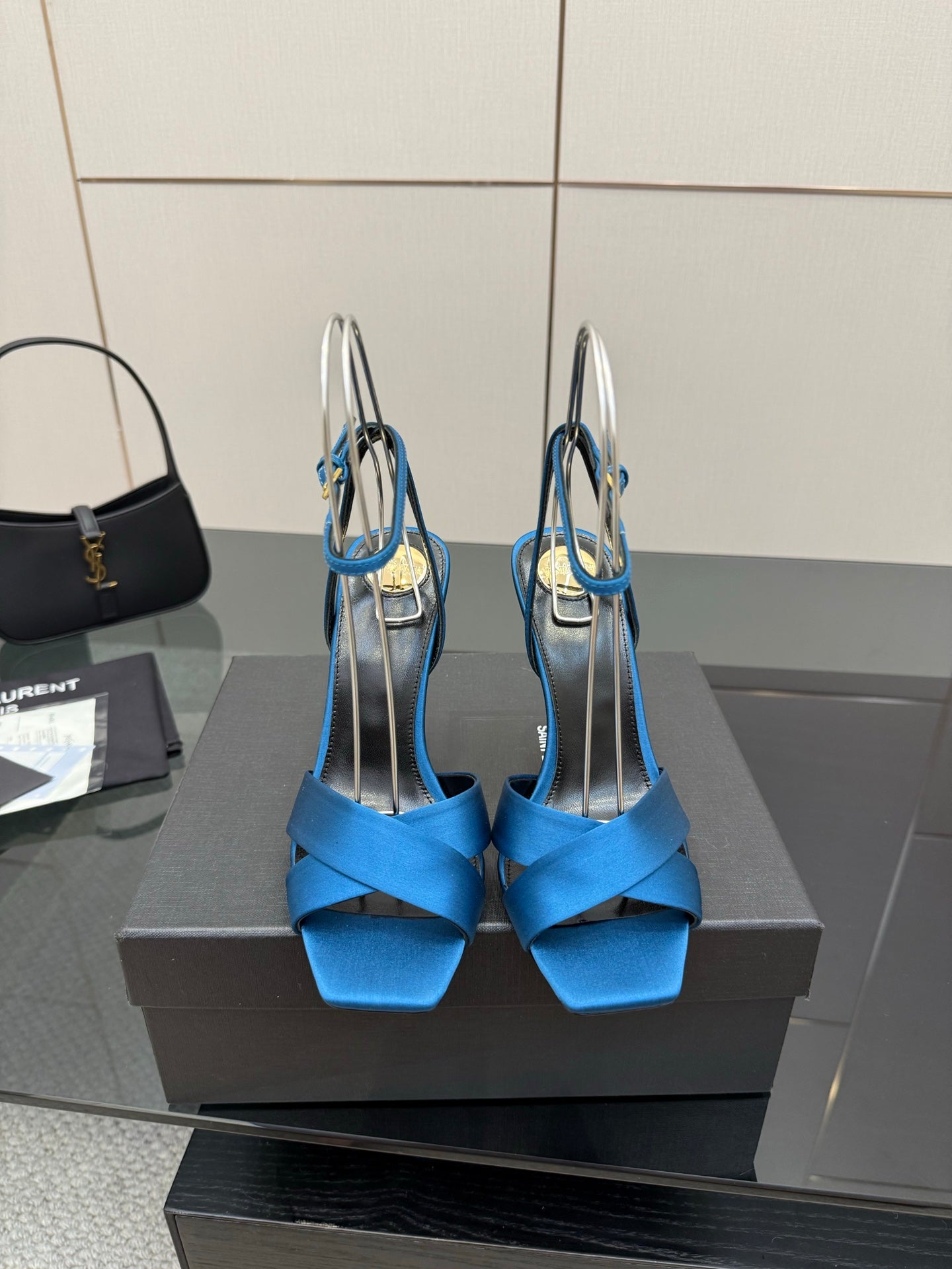 Blue strappy high-heel sandals with open toe and thin stiletto heel