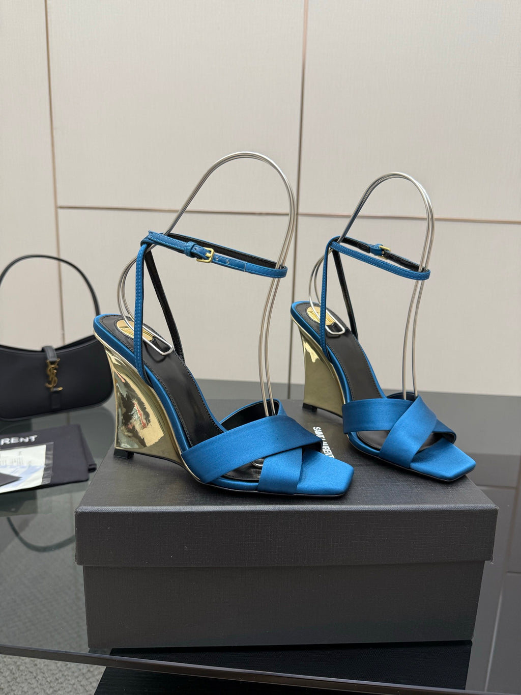 Blue strappy high-heel sandals with ankle strap and pointed toe