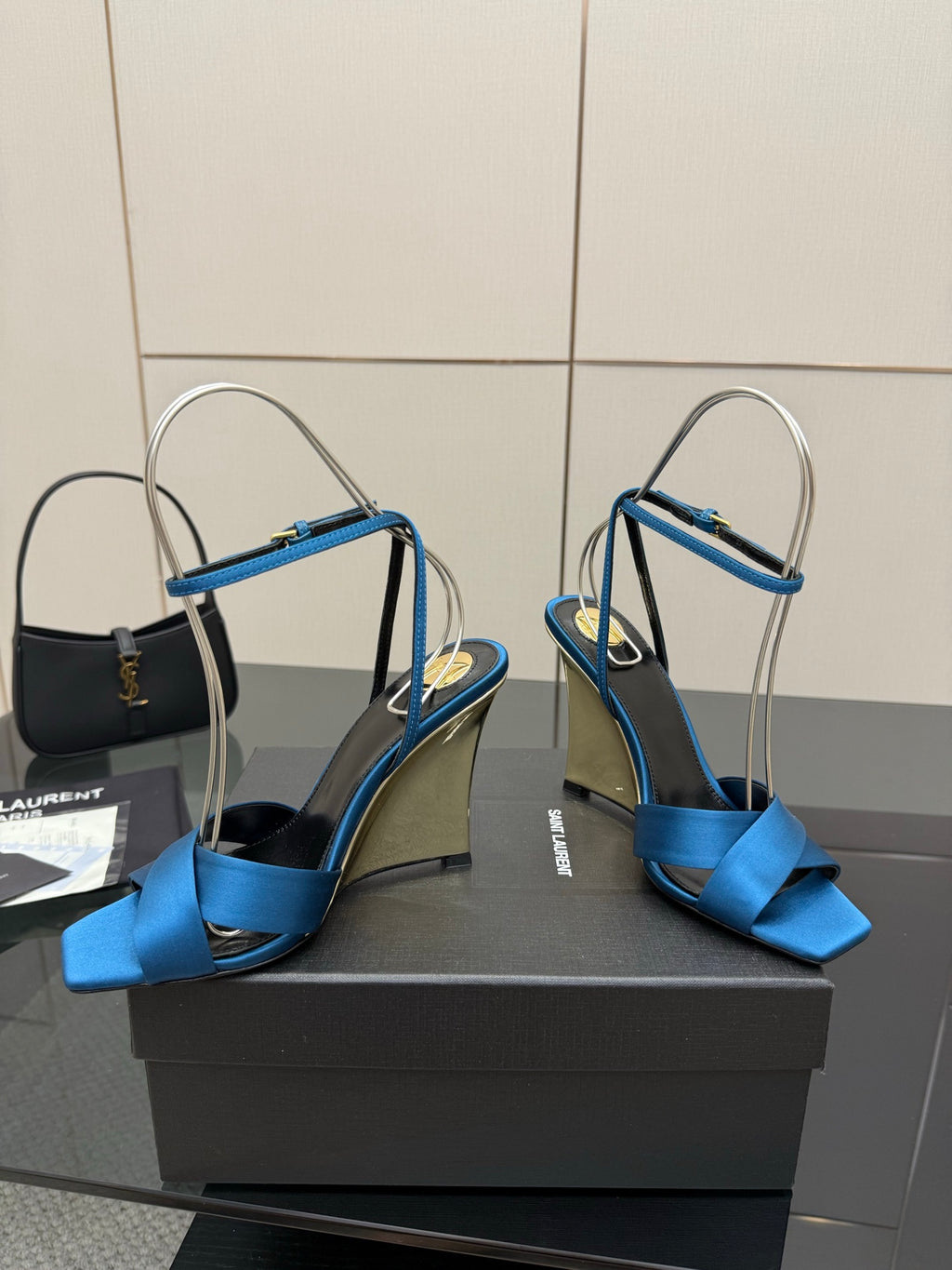 Blue strappy high-heel sandals with open toe, ankle strap, and stiletto heel