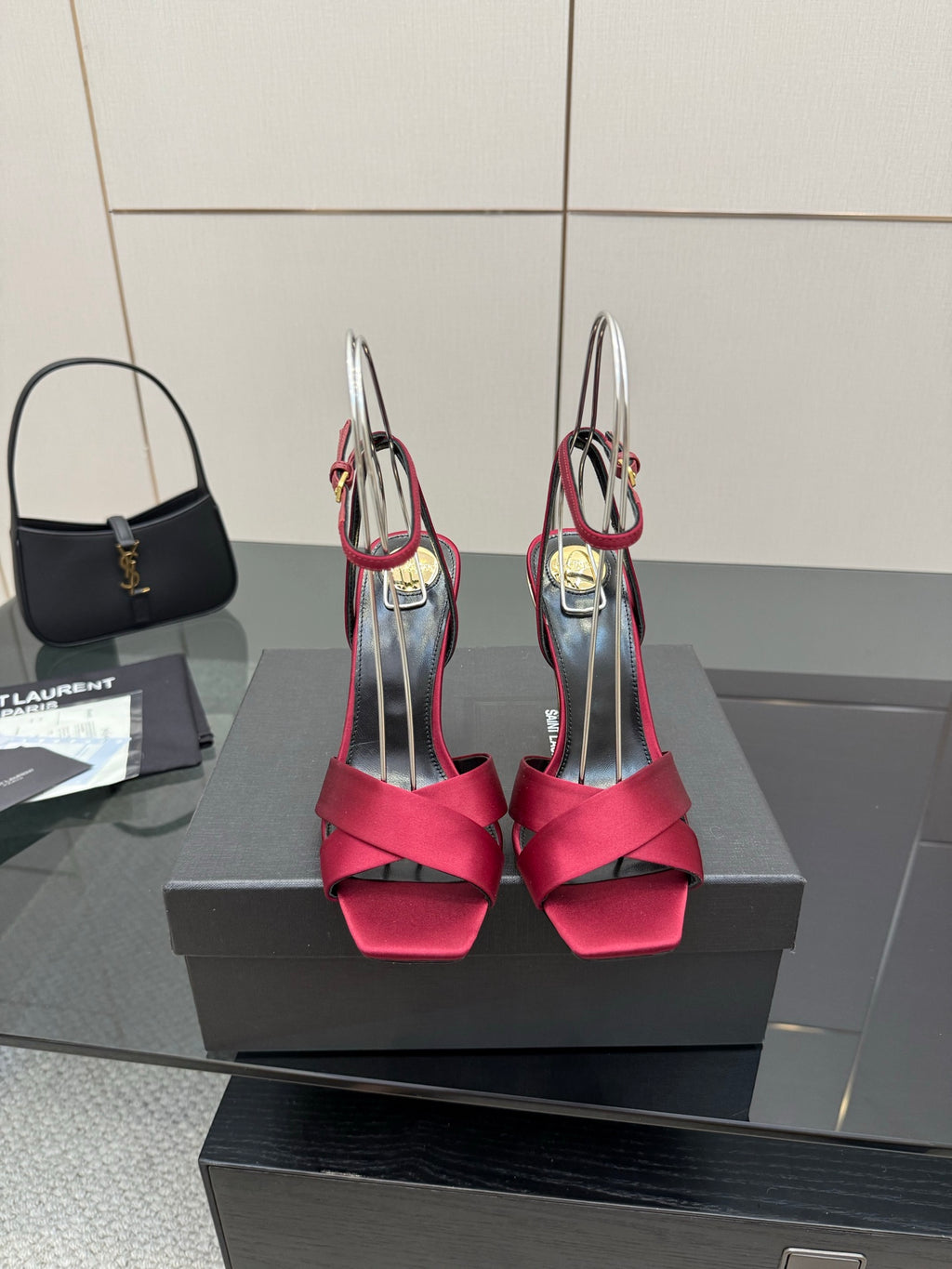 Women's heeled sandals with pink bow straps, gold heel accents, and slingback ankle strap