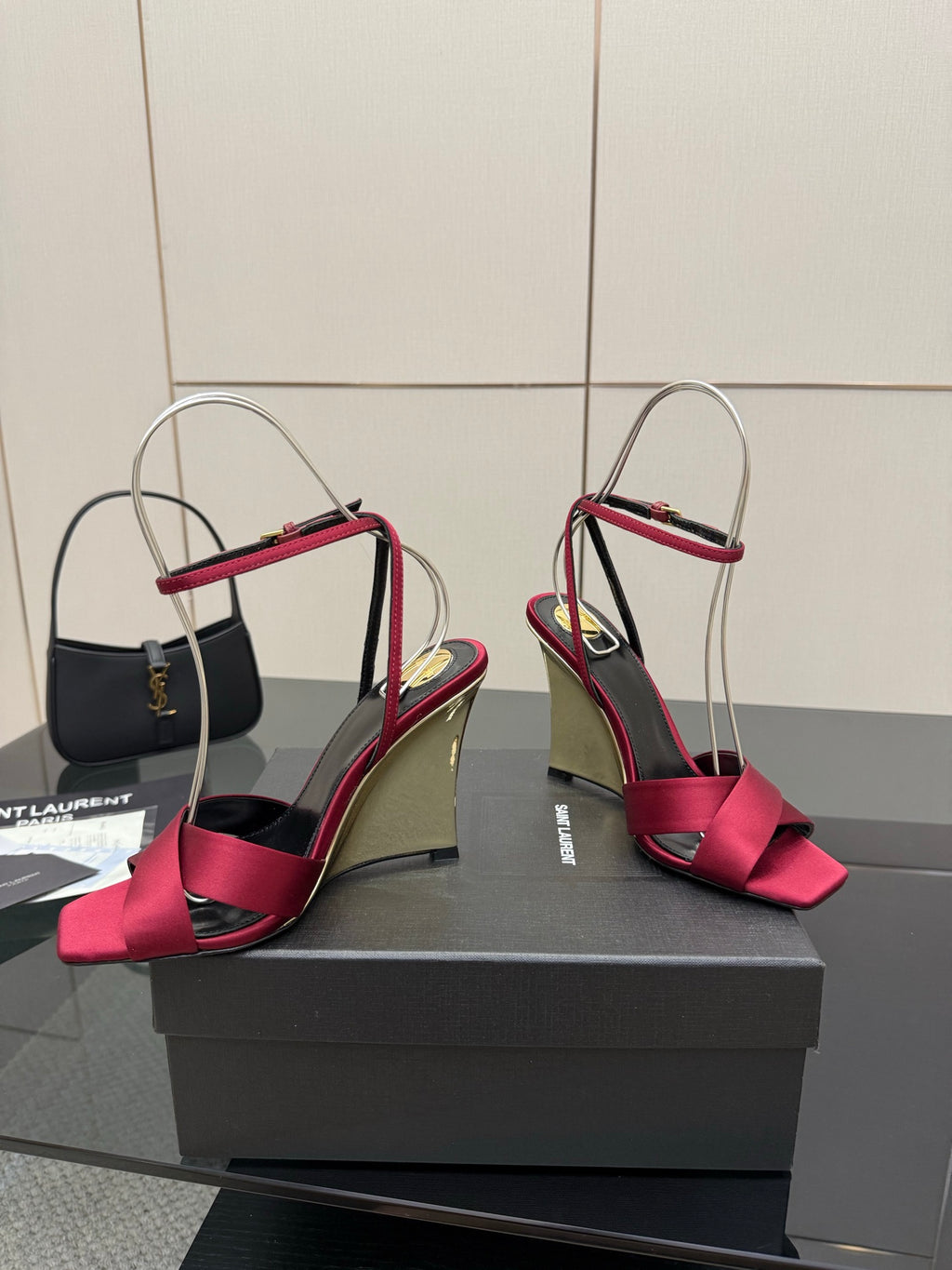 Women's heeled sandals with pink bow straps, mirrored gold heel, and slingback ankle strap