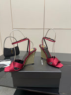 Women's heeled sandals with pink bow straps, mirrored gold heel, and slingback ankle strap