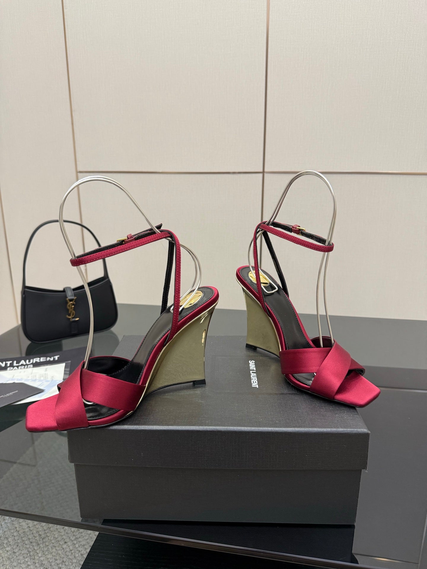 Women's heeled sandals with pink bow straps, mirrored gold heel, and slingback ankle strap