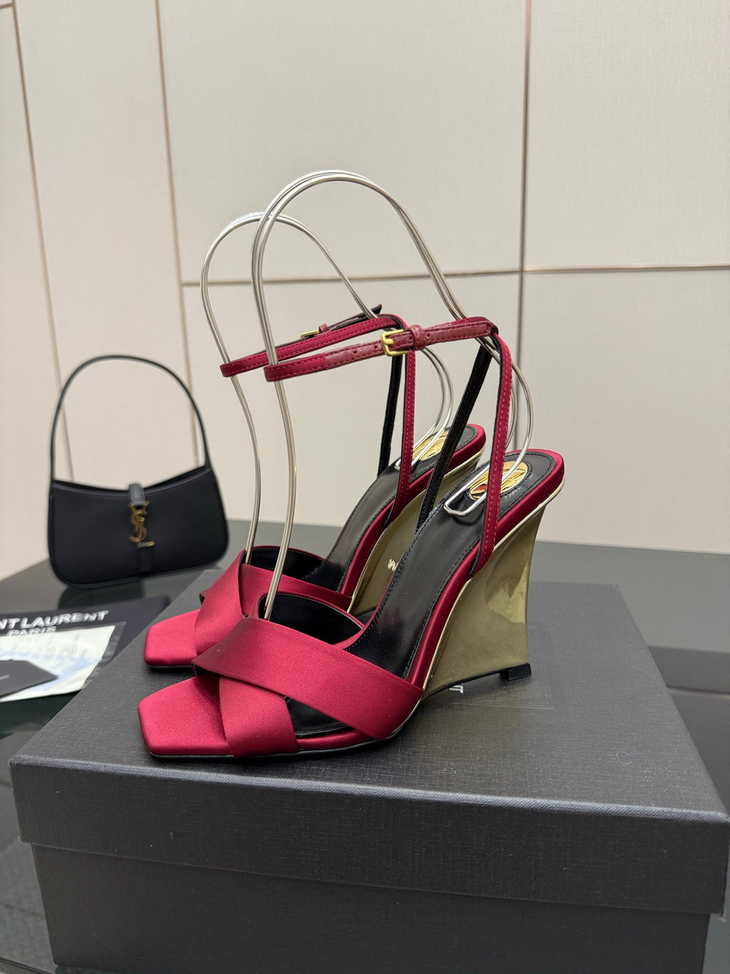 Women's heeled sandal with pink bow front straps and mirrored gold wedge heel