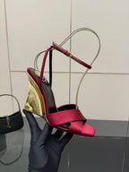 Close-up of women's heeled sandal with pink bow straps and mirrored gold heel