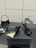 Black platform wedge sandals with open toe and gold-pattern insole panel