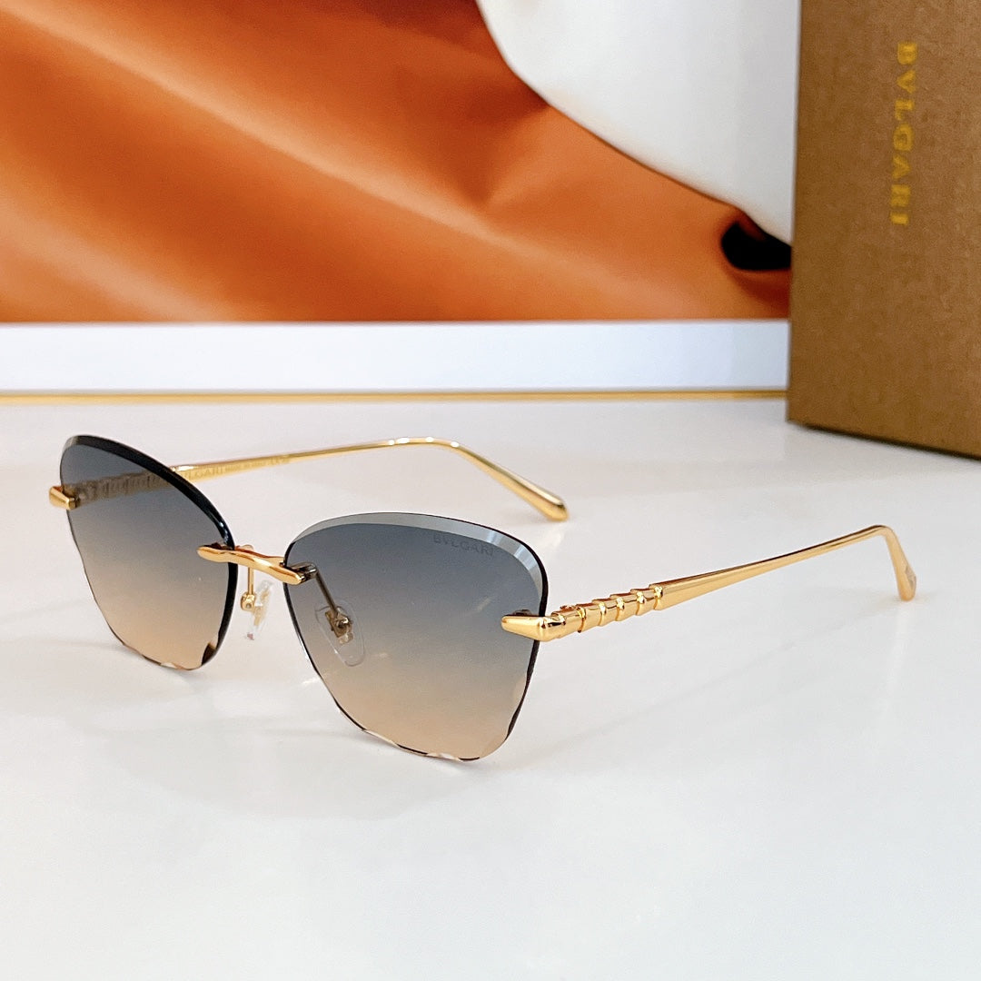 Bvlgari sunglasses with gradient lenses in dark blue and beige tones.