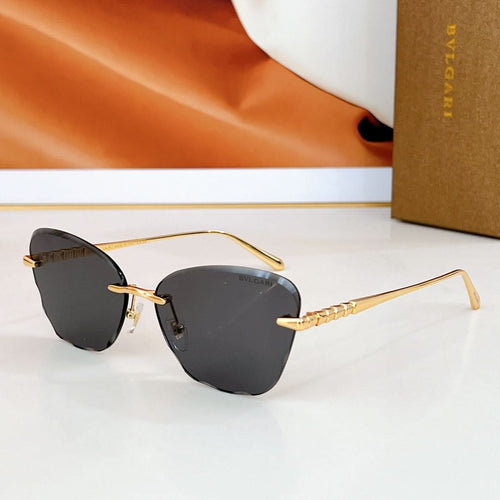 Bvlgari sunglasses with dark gray lenses and gold-tone metal frames.