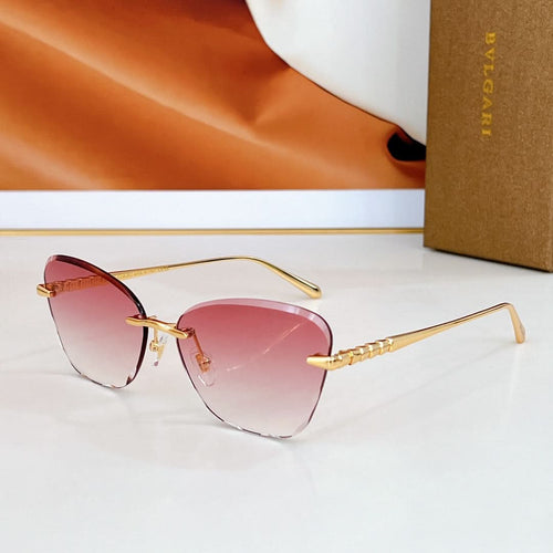 Bvlgari sunglasses with pink lenses and gold-tone metal frames.
