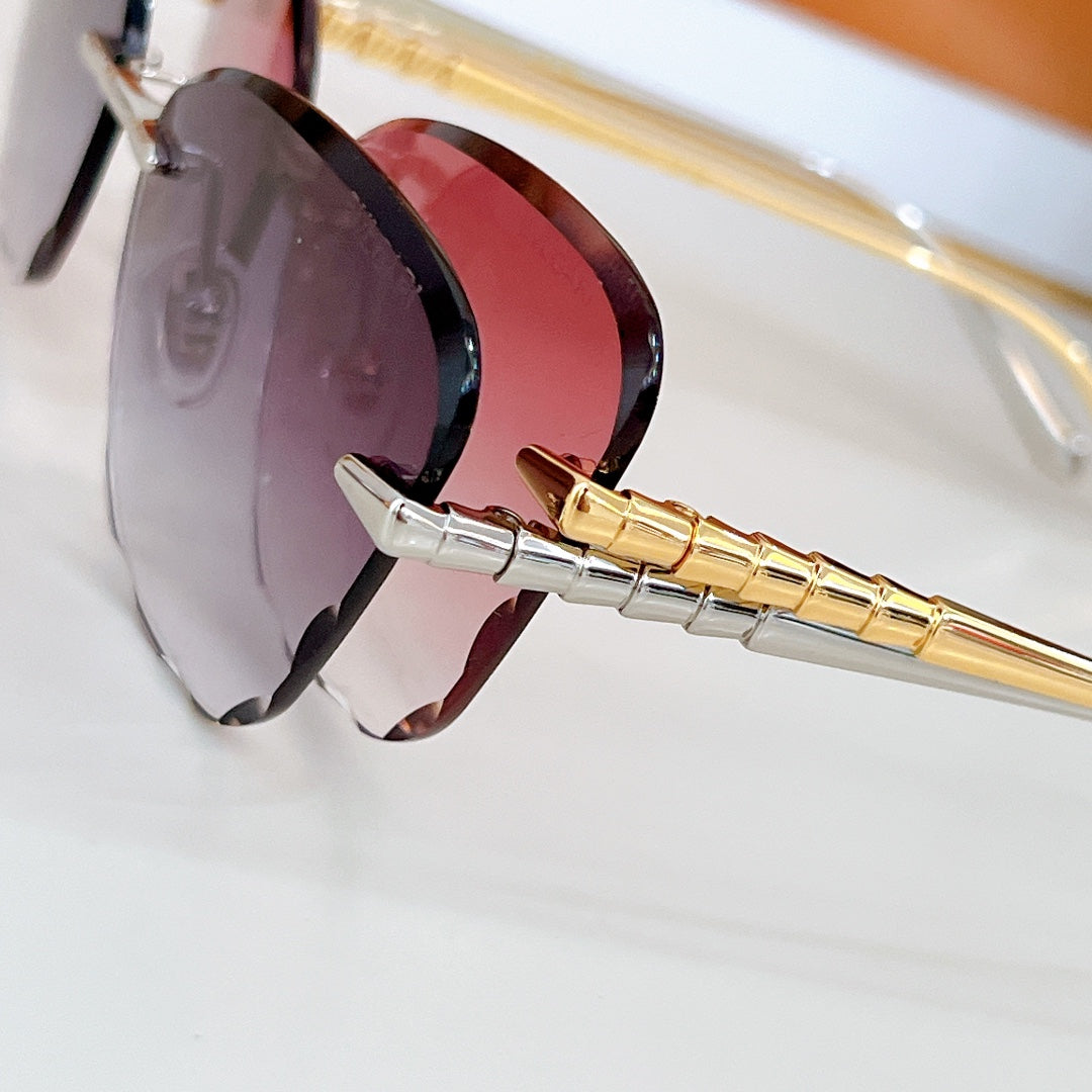 Bvlgari sunglasses close-up with purple and red lenses on gold-tone temple.