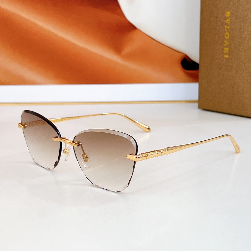 Bvlgari sunglasses with dark brown lenses and gold-tone metal frames.
