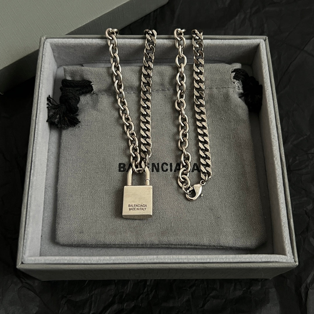 Two-tone chain necklaces in box with square padlock pendants and B charms