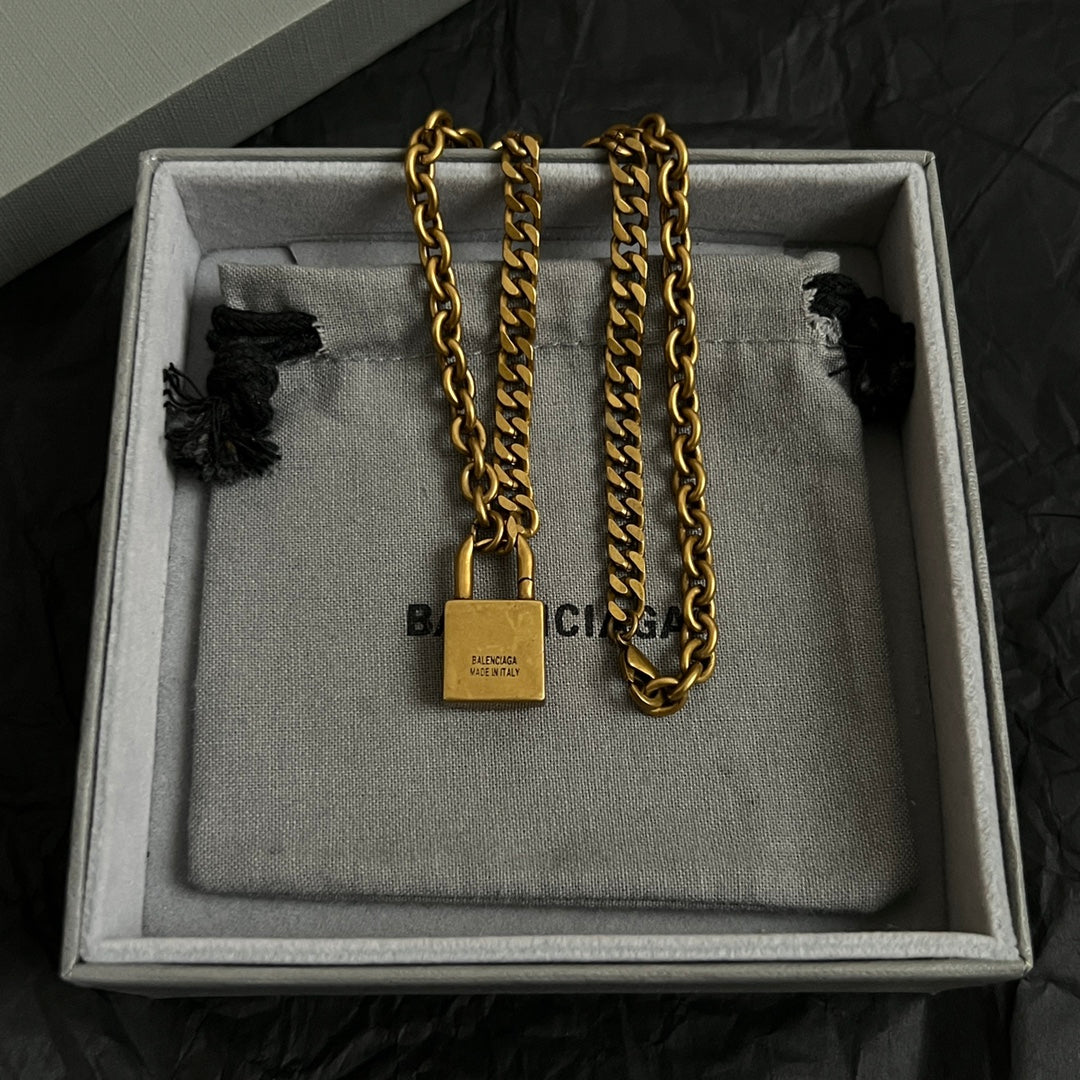 Balenciaga necklace set with padlock charms on mixed metal chains