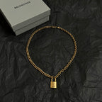Gold Balenciaga necklace chain with square B charm