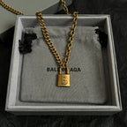 Balenciaga necklace with gold chain and square B padlock charm