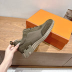 Hermes unisex sneakers in olive canvas with lace-up front and striped rubber tread sole