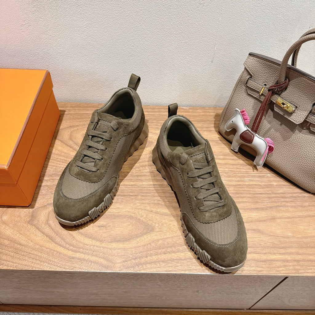 Hermes unisex sneakers, olive canvas upper with lace-up front and rubber tread sole