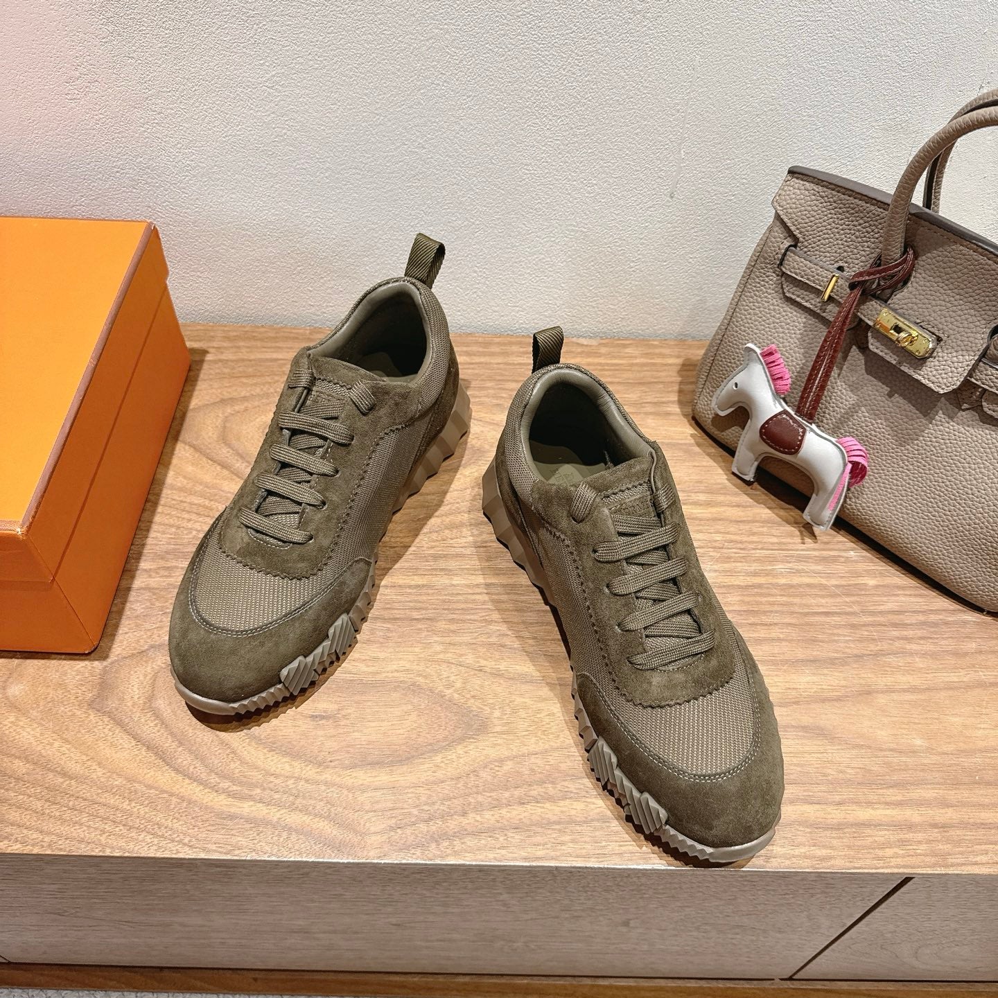 Hermes unisex sneakers, olive canvas upper with lace-up front and rubber tread sole
