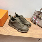 Hermes unisex lace-up sneakers in olive canvas with textured panels and chunky tread sole