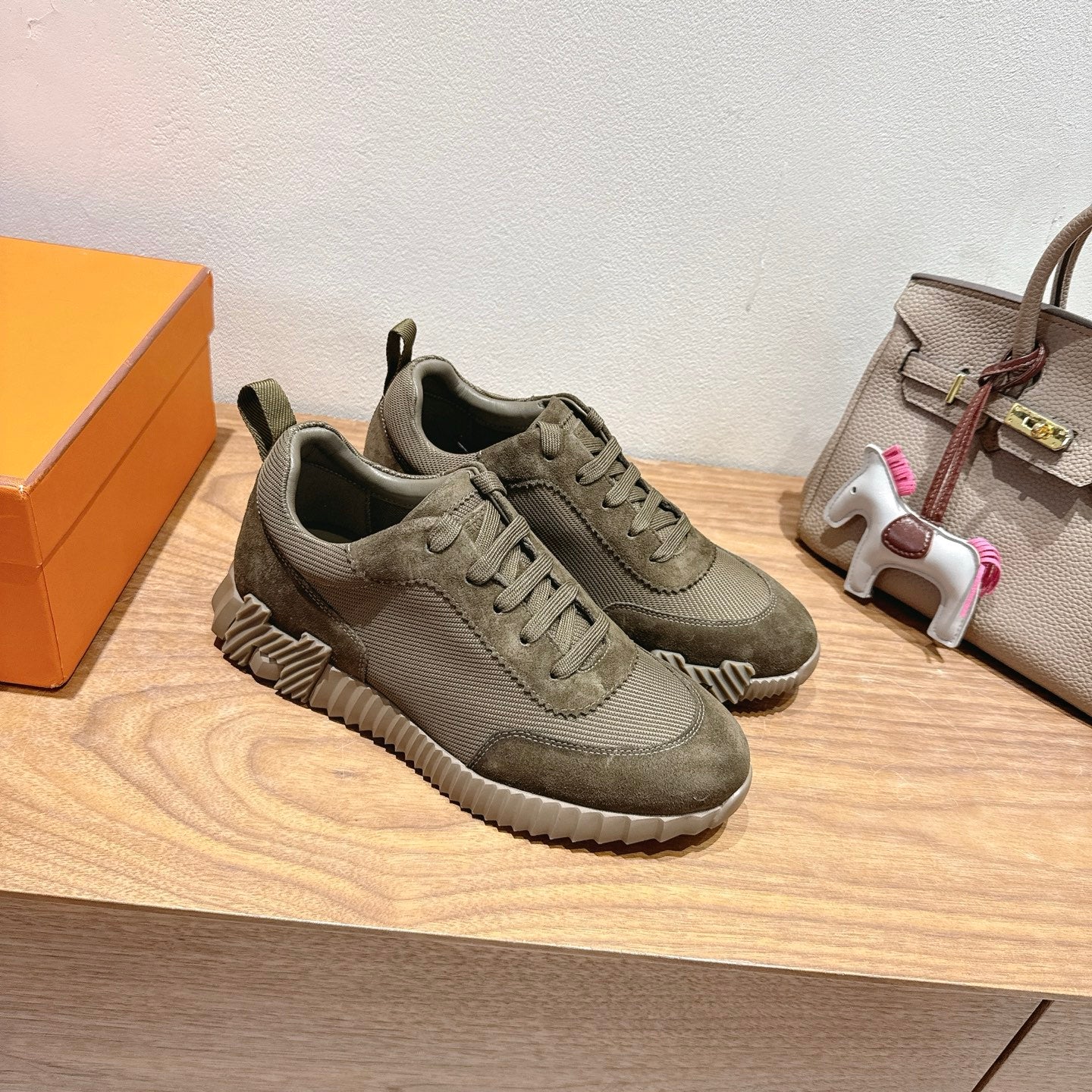 Hermes unisex lace-up sneakers in olive canvas with textured panels and chunky tread sole